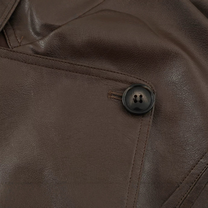 Women's tailored cropped faux leather jacket with tie belt and asymmetric button placket Mune Fashion