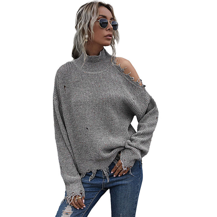Women chunky knit sweater with high collar, asymmetrical shoulder cut-out and frayed hem Mune Fashion