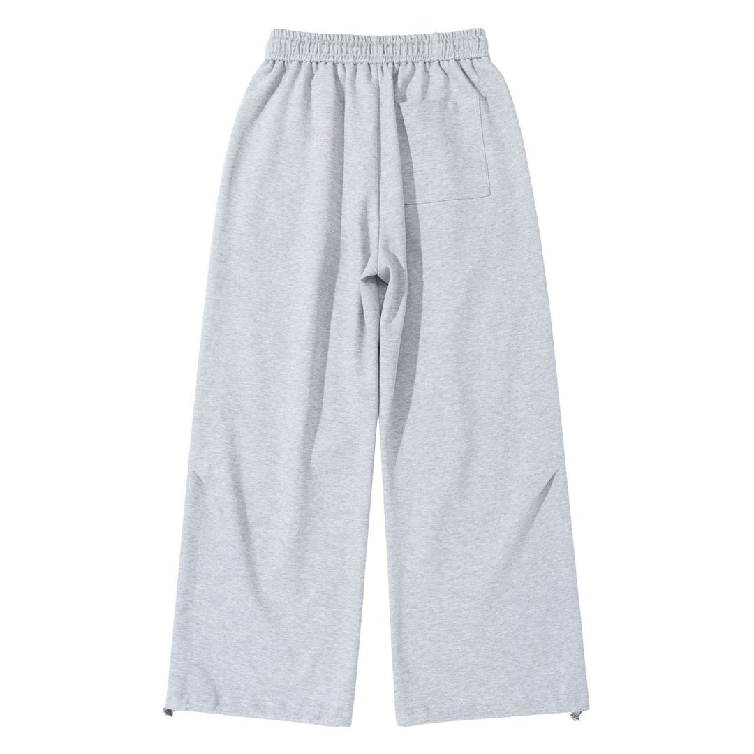 Unisex Wide French-Terry Sweatpants with elastic drawstring waistband, side pockets, and adjustable hem.
