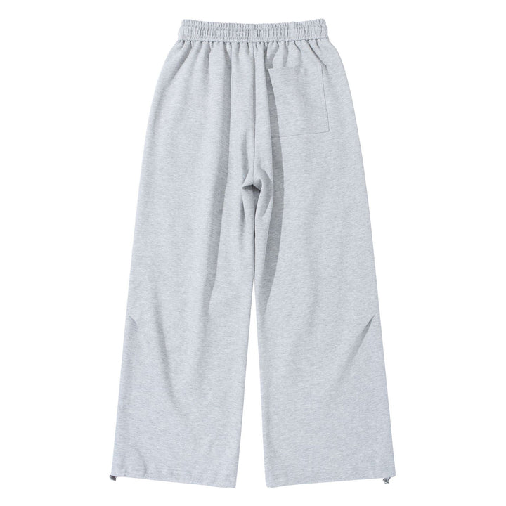 Unisex Wide French-Terry Sweatpants with elastic drawstring waistband, side pockets, and adjustable hem.