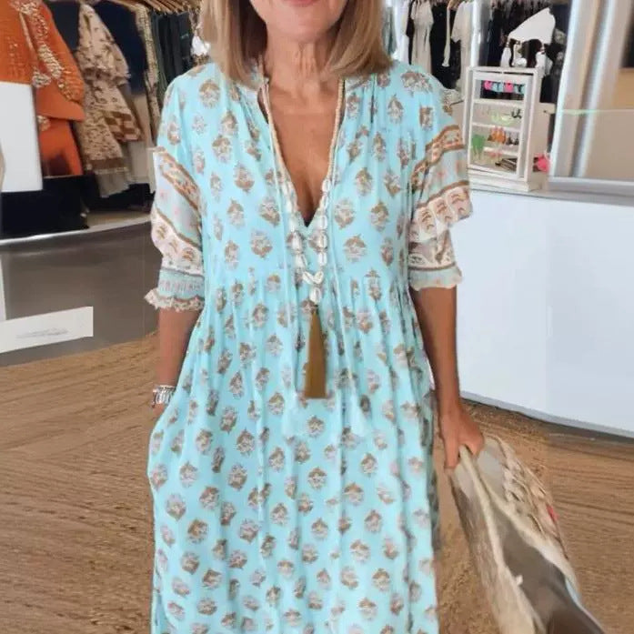Women Boho Maxi Dress made of lightweight viscose blend with V-neck, tassel tie, three-quarter sleeves, and side pockets Mune Fashion