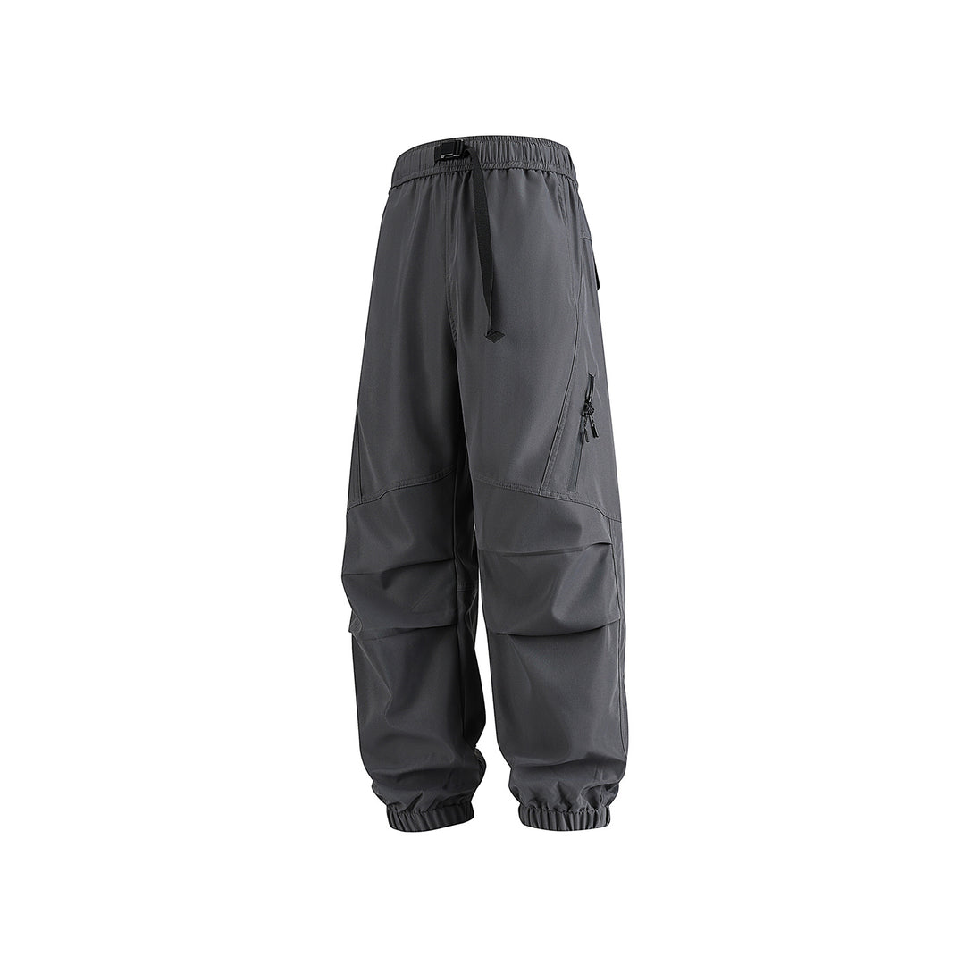 Men's loose technical cargo jogger pants with elastic drawstring waistband, patch flap pockets, and zippered leg pocket Drune