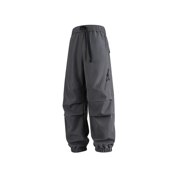 Men's loose technical cargo jogger pants with elastic drawstring waistband, patch flap pockets, and zippered leg pocket Drune
