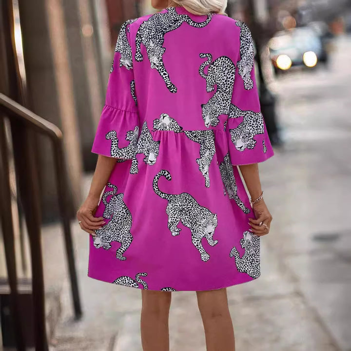 Women's casual tunic dress with gathered waist seam, button placket, and graphic animal silhouette print Mune Fashion