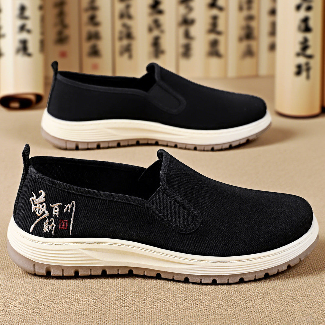Men's seamless canvas slip-on with elastic entry, embroidered heel motif and slip-resistant EVA outsole Mune Fashion
