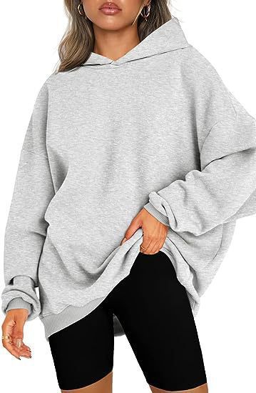 Women's oversized hoodie in longline cut with raglan sleeves and soft inner lining Mune Fashion