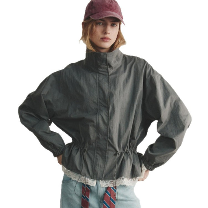 Women's oversized windbreaker with high stand-up collar, drawstring waist, and elastic cuffs