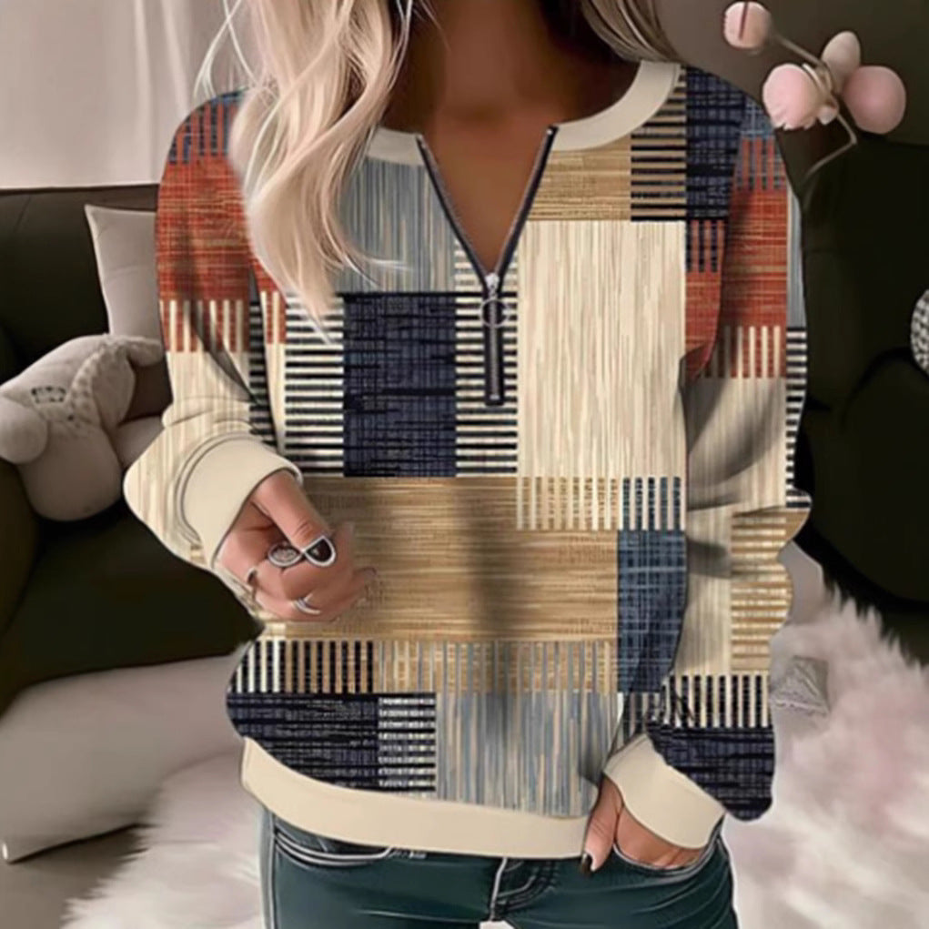 Women's cozy sweater with short zip, graphic patchwork pattern, extended sleeve cuffs, and ribbed hem Mune Fashion
