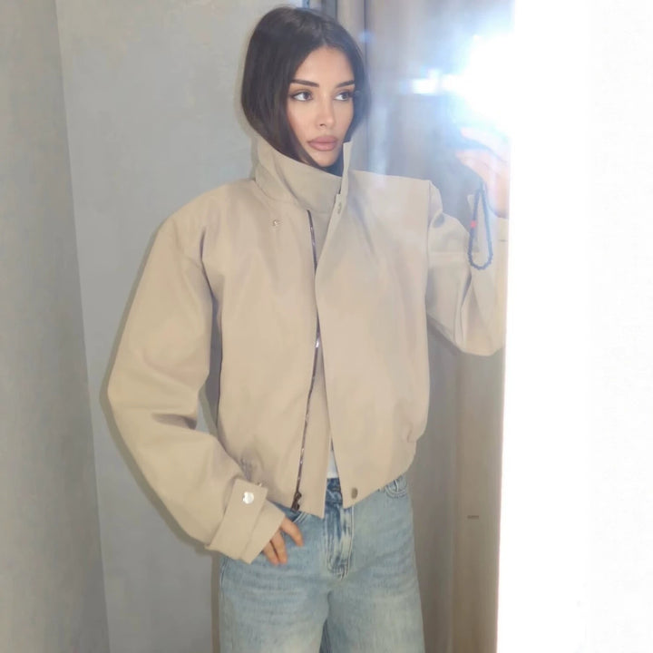 Ladies short jacket with high stand-up collar, elastic waistband and concealed snap button placket Mune Fashion