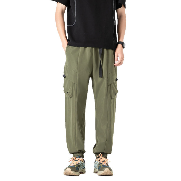 Men's loose cargo jogger pants with elastic drawstring waistband, multiple flap pockets, and ribbed ankles Drune