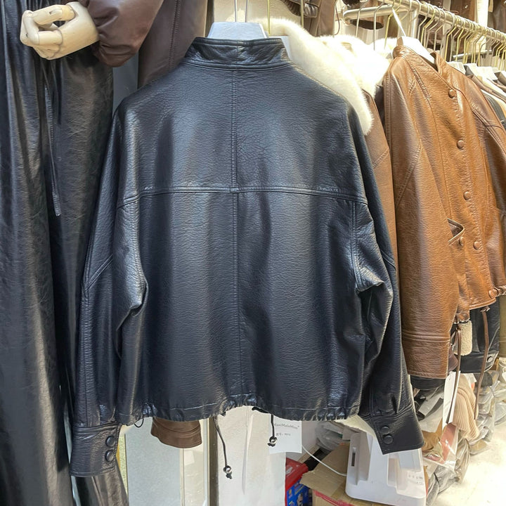 Women Short Leather Jacket with textured grain, stand-up collar, and drawstring waistband Mune Fashion