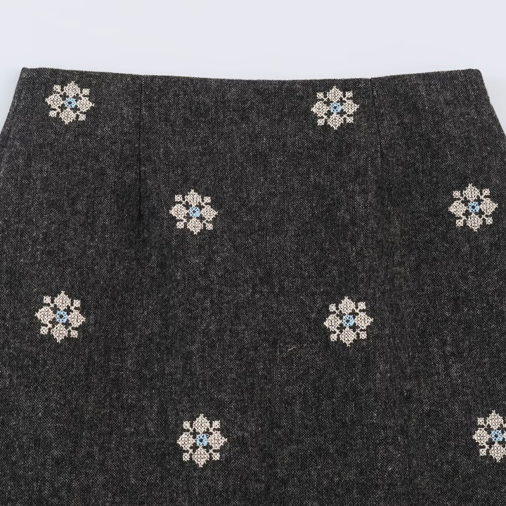 Women's wool blend pencil skirt with embroidered floral motifs and central slit Mune Fashion