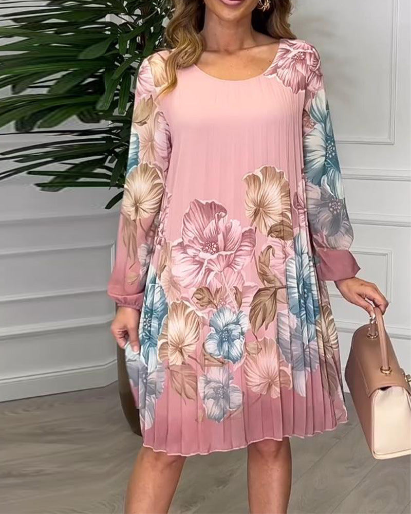 Ladies knee-length pleated chiffon dress with floral print, transparent sleeves and round neckline Mune Fashion