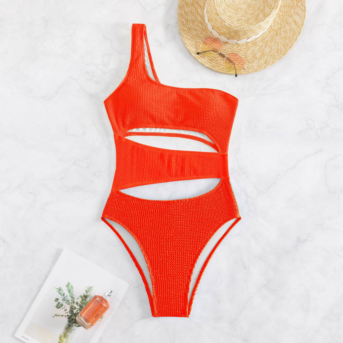 Women’s one-piece swimsuit with asymmetric design and trendy cut-outs Mune Fashion