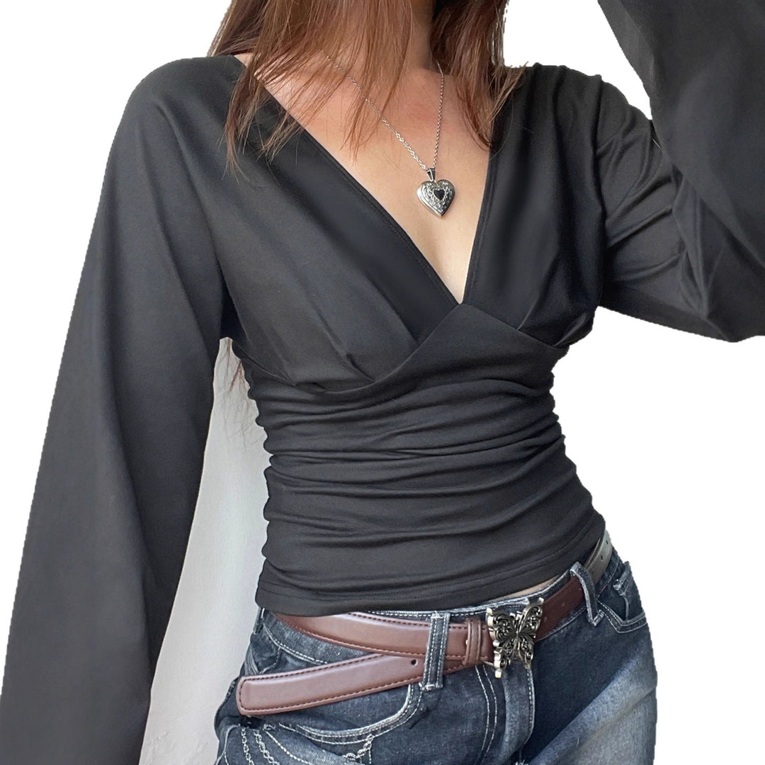 Women's figure-hugging long-sleeve top with deep V-neckline, neck tie for binding, and tailored silhouette Mune Fashion