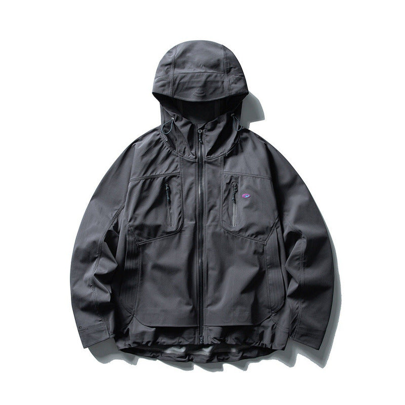 Unisex Technical Softshell Field Jacket with welded seams, four zippered pockets, and extended back part Mune Fashion