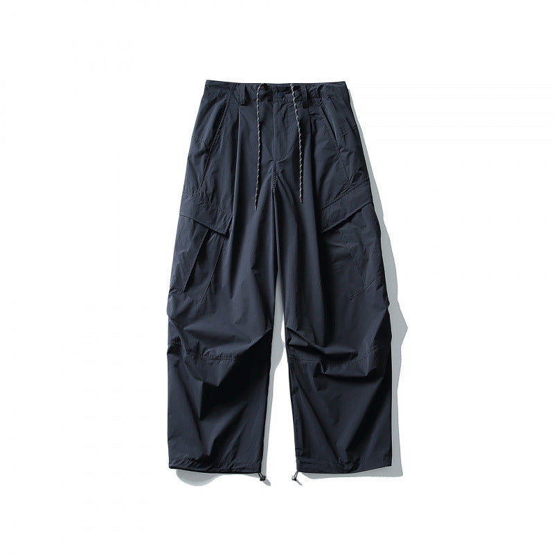 Men's loose technical cargo pants with drawstring waistband and adjustable leg closures Mune Fashion