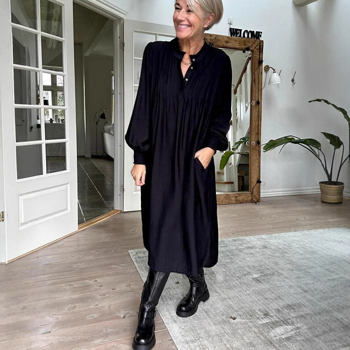 Ladies' loose midi dress with fine pleated look, stand-up collar, short button placket, smocked cuffs, and side pockets Mune Fashion