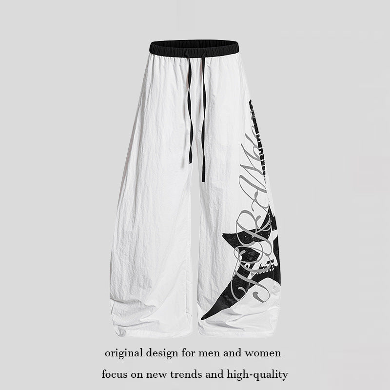 Women's Wide Palazzo Trousers with Drawstring Waist and Large Statement Print Mune Fashion