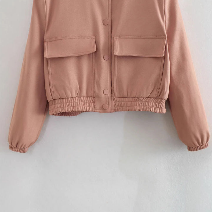 Women's short bomber jacket with stand-up collar, snap button placket, patch pockets, and elastic hem Mune Fashion