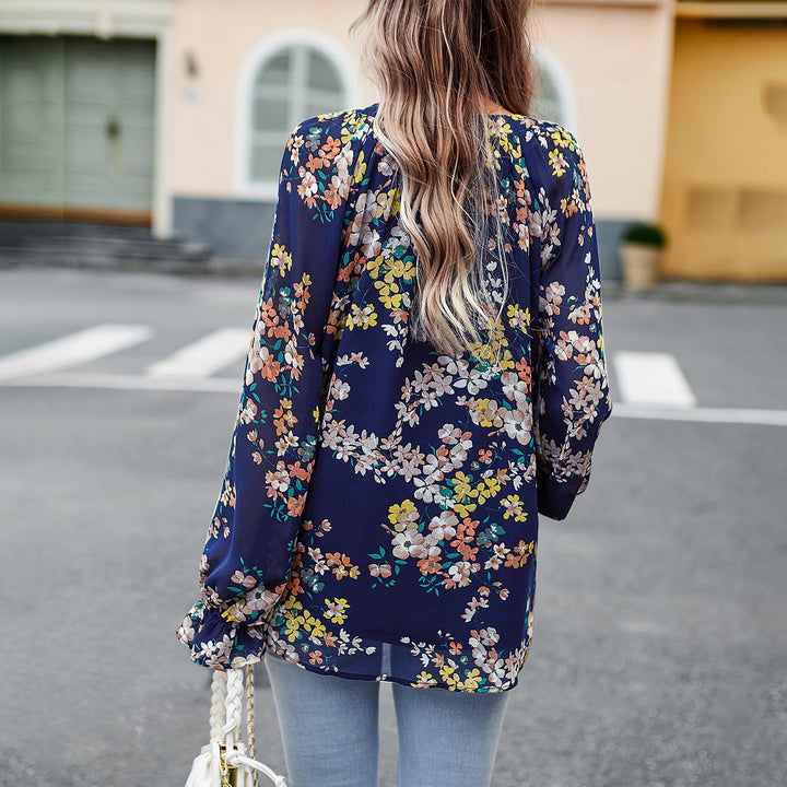 Women nan Chiffon blouse with floral all-over print, V-neck, button placket and tied cuffs Mune Fashion