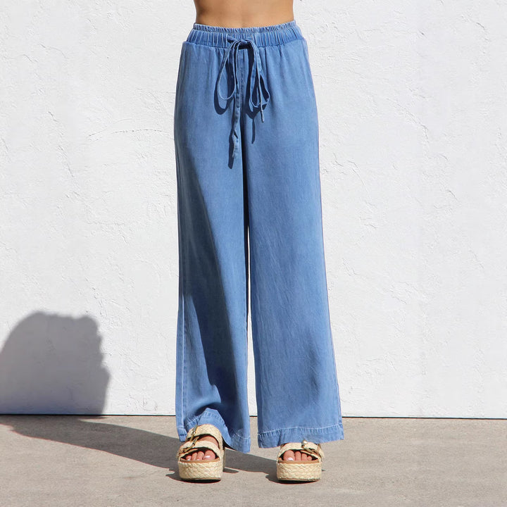 Ladies' wide linen-look summer trousers with elastic waistband, drawstring, and side pockets Mune Fashion