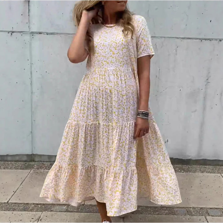 Women's flowing tiered maxi dress in Boho babydoll style with gathered underbust and short sleeves Mune Fashion