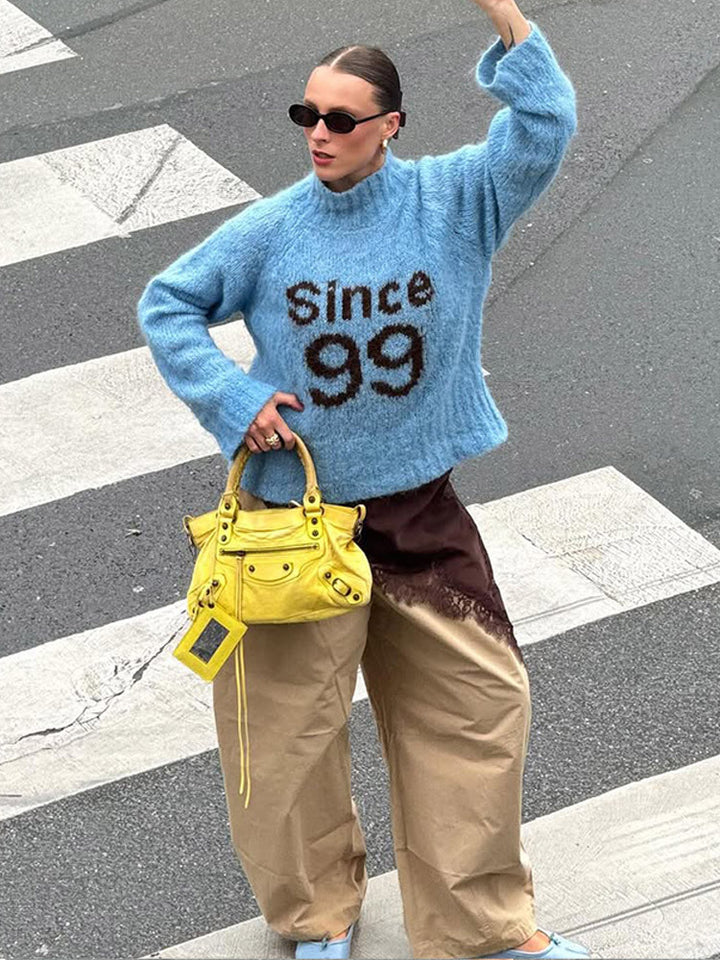 Women's cozy oversized mohair sweater with high roll neck and statement logo Mune Fashion