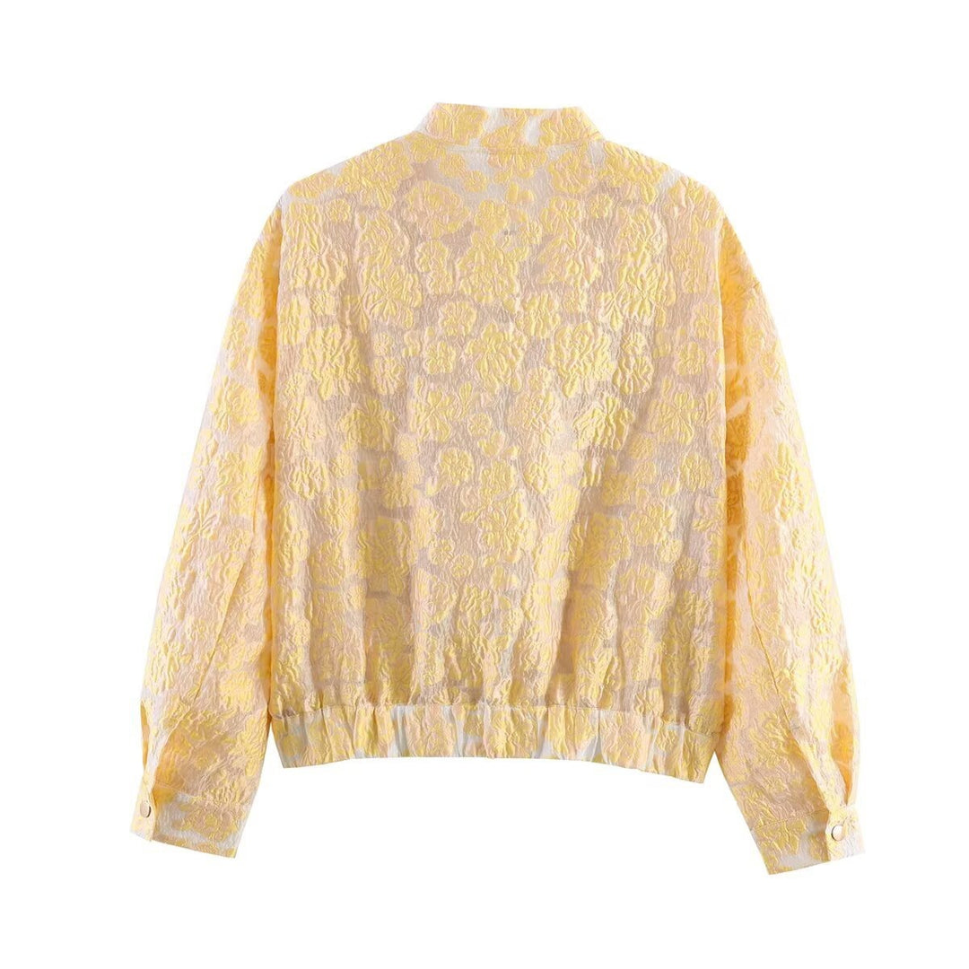 Women's short cut quilted bomber jacket with floral jacquard texture, elastic hem and patch pockets Mune Fashion