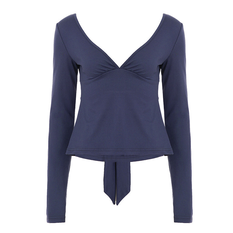 Women's fitted long-sleeve top with deep V-neck, shaped bust area, and tie detail Mune Fashion