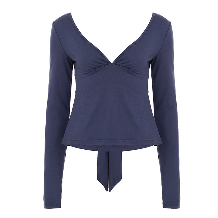 Women's fitted long-sleeve top with deep V-neck, shaped bust area, and tie detail Mune Fashion
