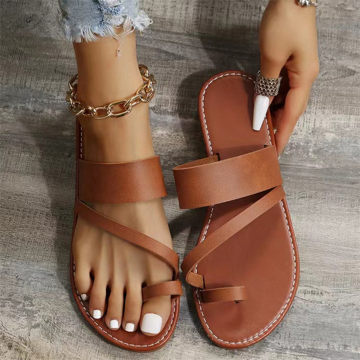 Women's flat faux leather thong sandal with crisscross straps and padded comfort footbed Mune Fashion