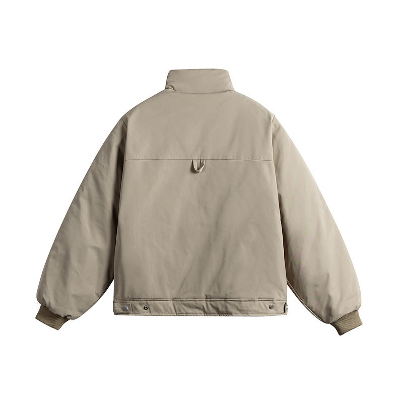 Unisex short cut quilted jacket with stand-up collar and ergonomic side inserts Mune Fashion
