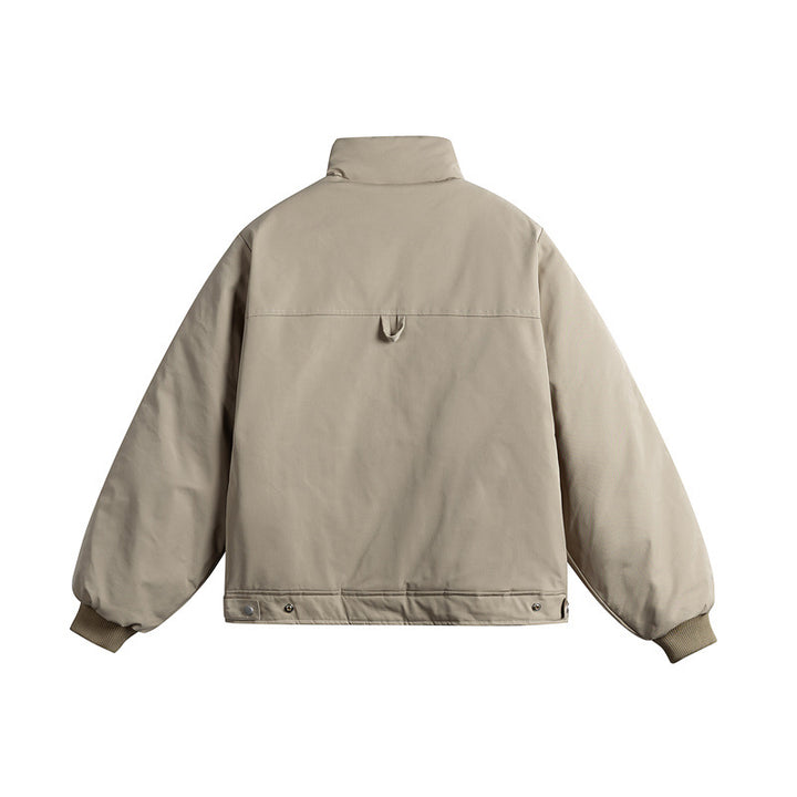 Unisex short cut quilted jacket with stand-up collar and ergonomic side inserts Mune Fashion