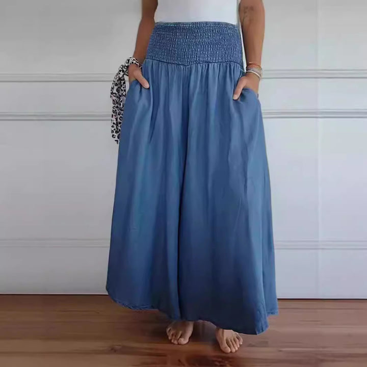 Women's maxi skirt with high smock waistband, wide fall and side pockets Mune Fashion