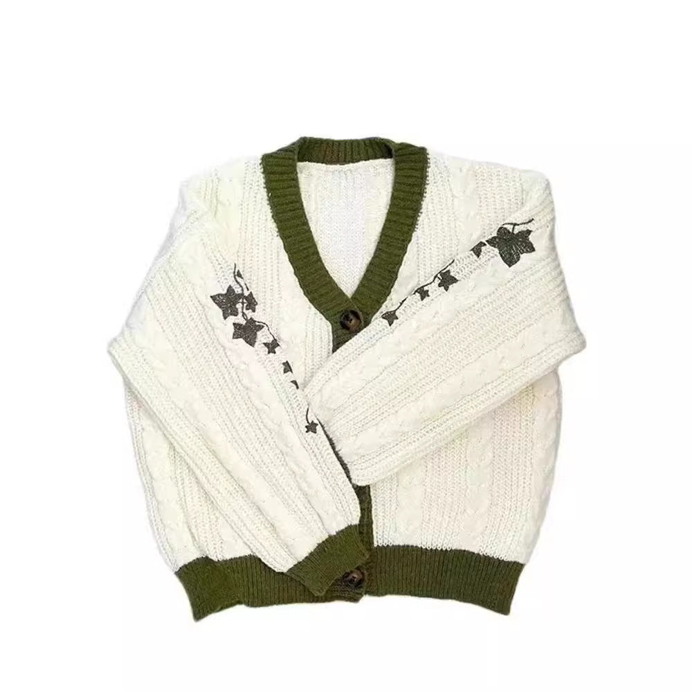 Women's knitted oversized cardigan with cable pattern, V-neck, button placket, and floral sleeve embroidery Mune Fashion