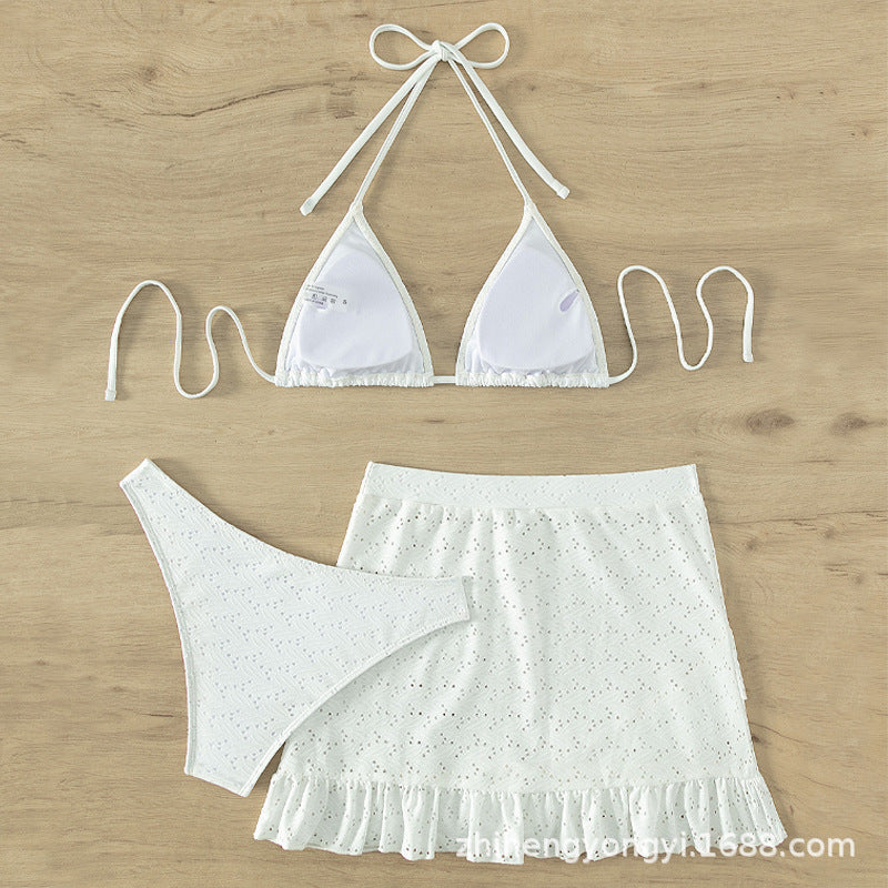 Women's triangle bikini with playful hole pattern and matching skirt Mune Fashion