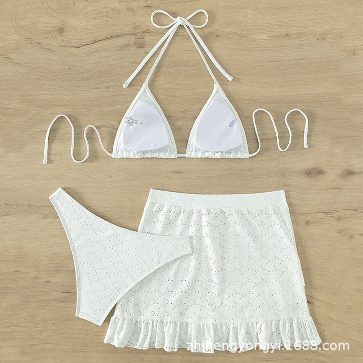 Women's triangle bikini with playful hole pattern and matching skirt Mune Fashion