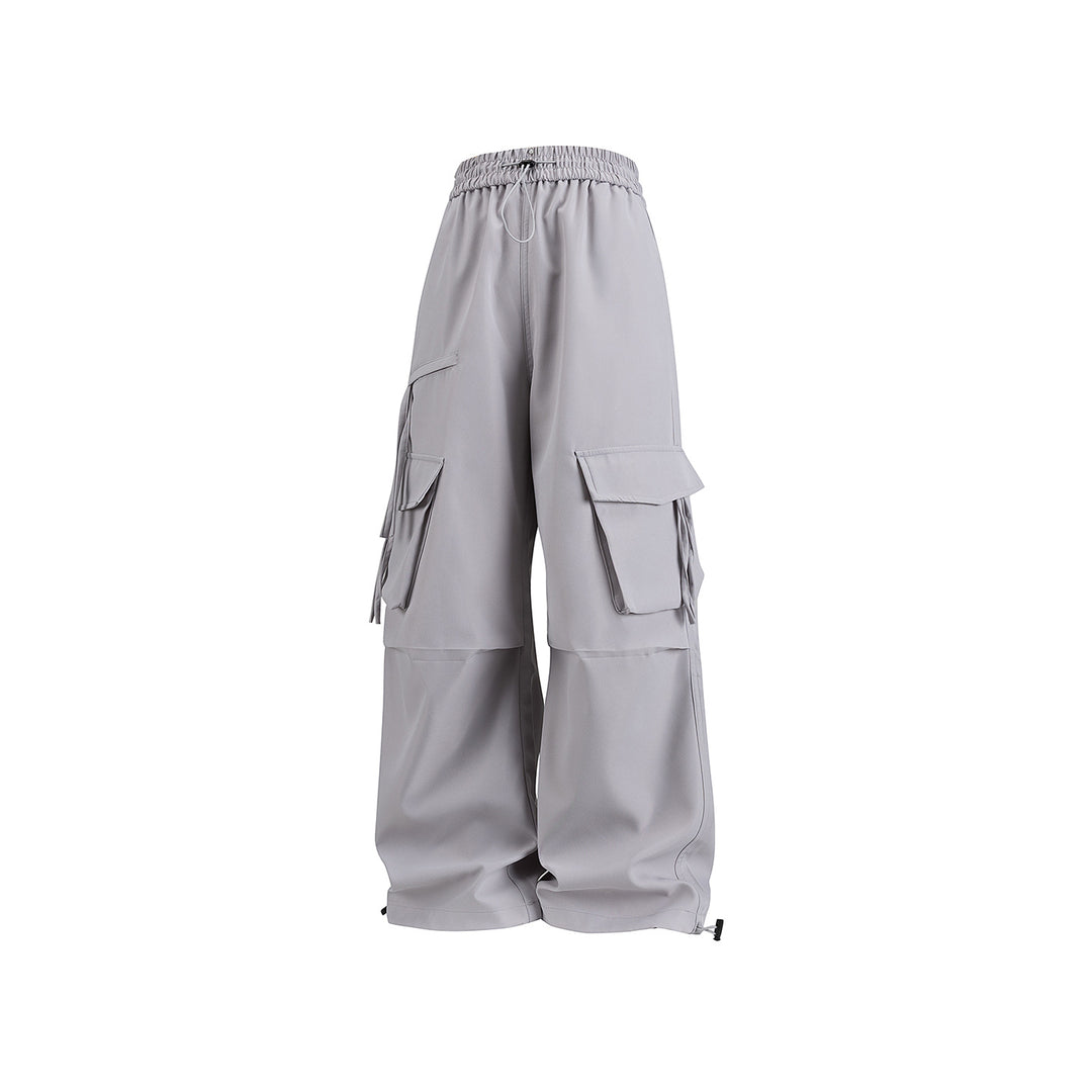 Damen Weite Cargo‑Hose im Baggy‑Cut mit elastischem Tunnelzugbund, Klapp‑Utility‑Taschen und verstellbarem Beinabschluss Mune Fashion