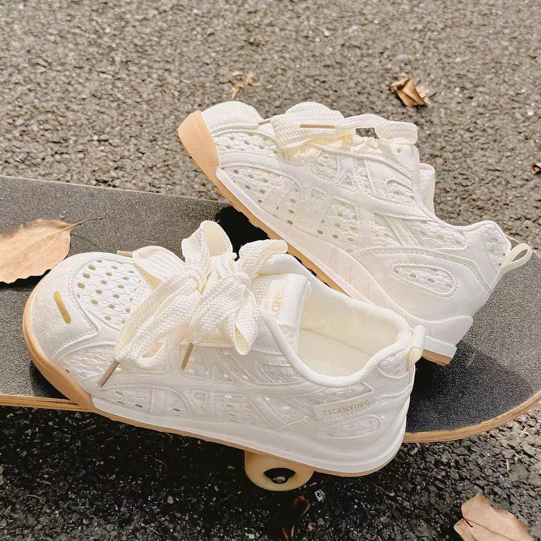 Ladies sporty platform sneakers with perforated upper material and decorative bows Mune Fashion