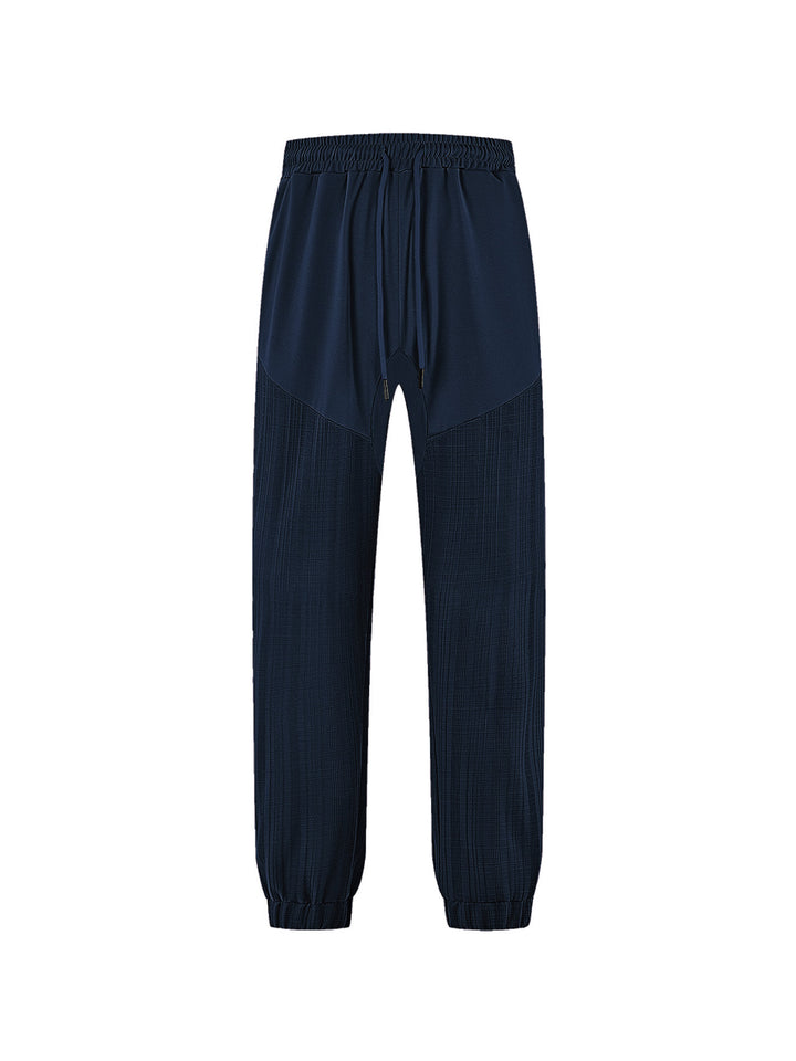 Men's slim-fit jogging pants with elastic drawstring waistband and textured knee panel Mune Fashion