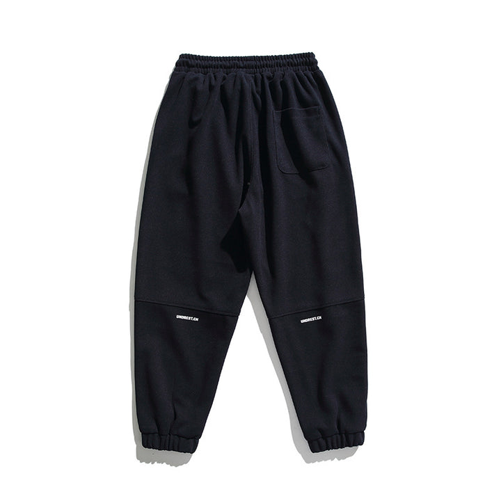 Unisex wide jogging pants in oversized cut with elastic waistband, knee panel and ribbed cuffs Mune Fashion