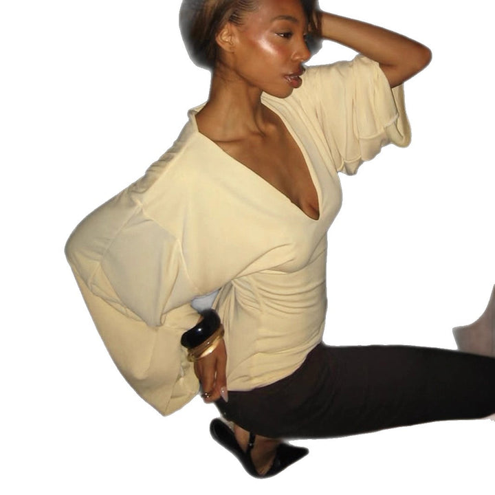 Women's tailored long sleeve cropped shirt with V-neck, dropped shoulder, and soft jersey quality Mune Fashion