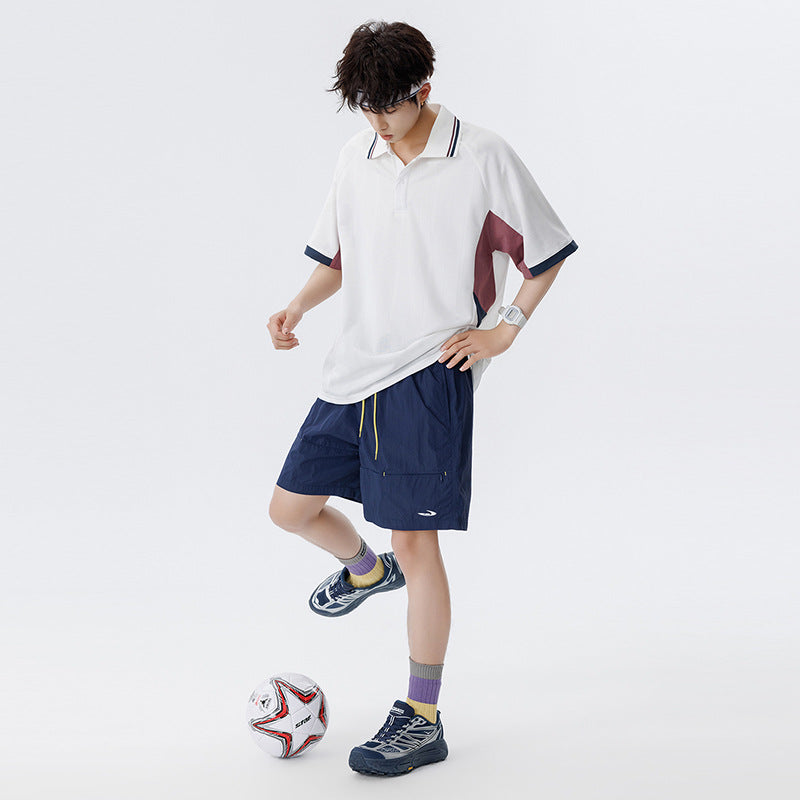 Unisex Boxy Oversize Polo Shirt made of technical functional jersey with contrast panels and raglan sleeves Drune
