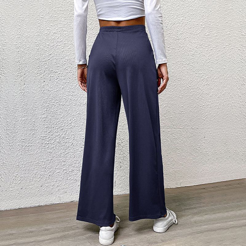 Ladies high-waisted wide trousers with front pleats, elastic waistband and side pockets Mune Fashion