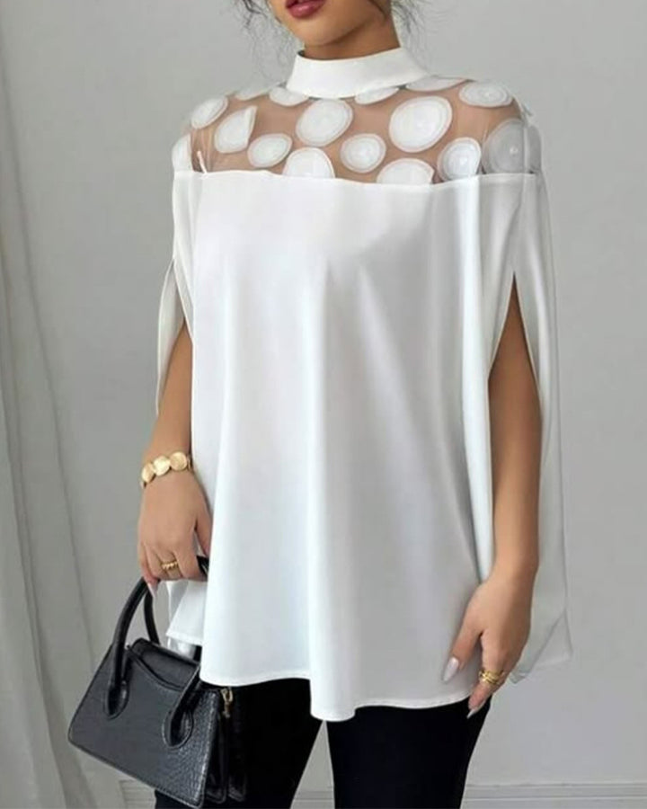 Women’s loose-fitting blouse with transparent round appliqué insert and cape sleeves Mune Fashion