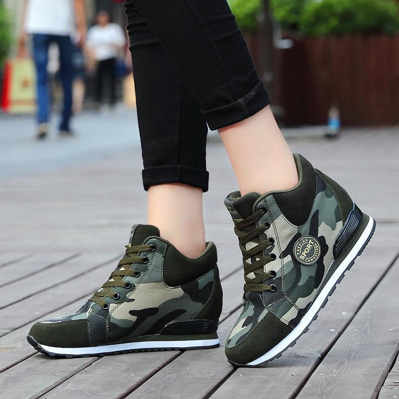 Women’s mid-high wedge running sneakers in a material mix with concealed inner wedge, padded ankle collar, and grippy tread sole Mune Fashion