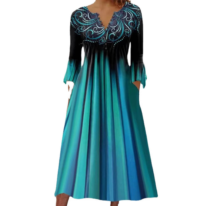 Women's flowing maxi dress with embellished V-neck, underbust seam, flared skirt and side pockets Mune Fashion