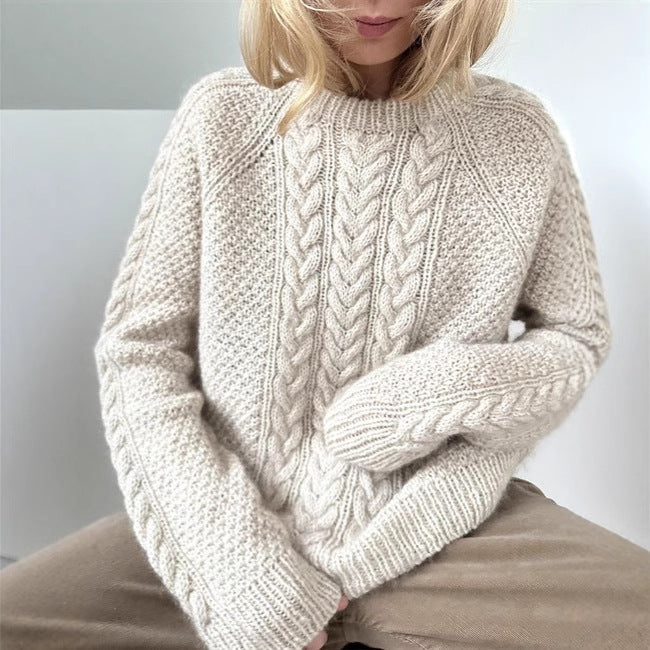 Women's oversized knitted sweater with cable pattern