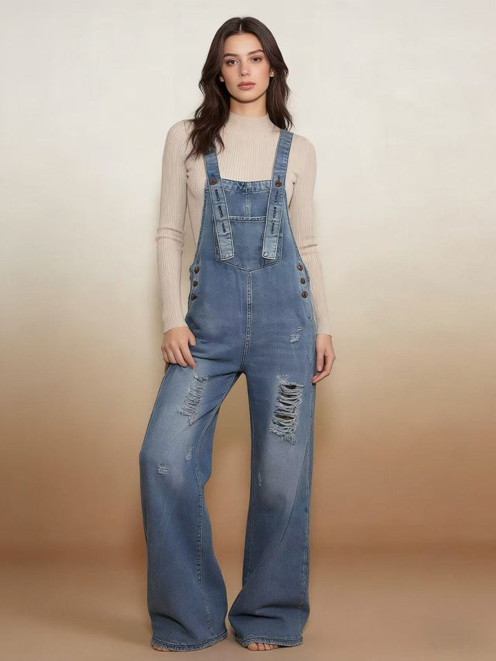Women's modern baggy overalls made of pigment-dyed stretch denim with adjustable straps and visible rips Mune Fashion